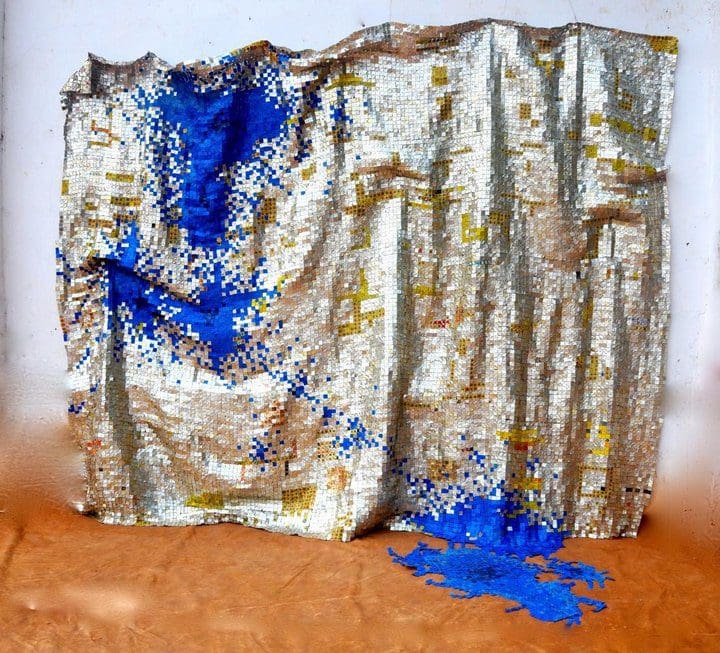 Colorful textile art with blue and gold.