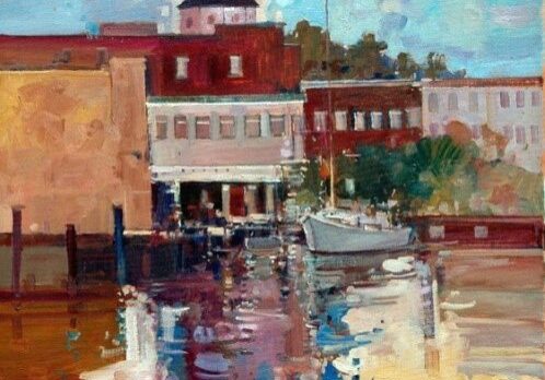 Colorful harbor scene with buildings and boat.
